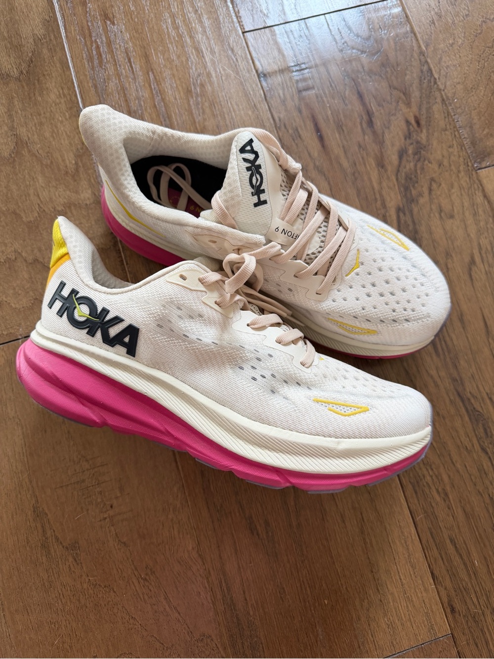 Hoka Cream Athletic Shoes with Pink Sole & Yellow Accents